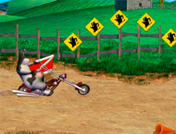 Gioco Una mucca su una moto.